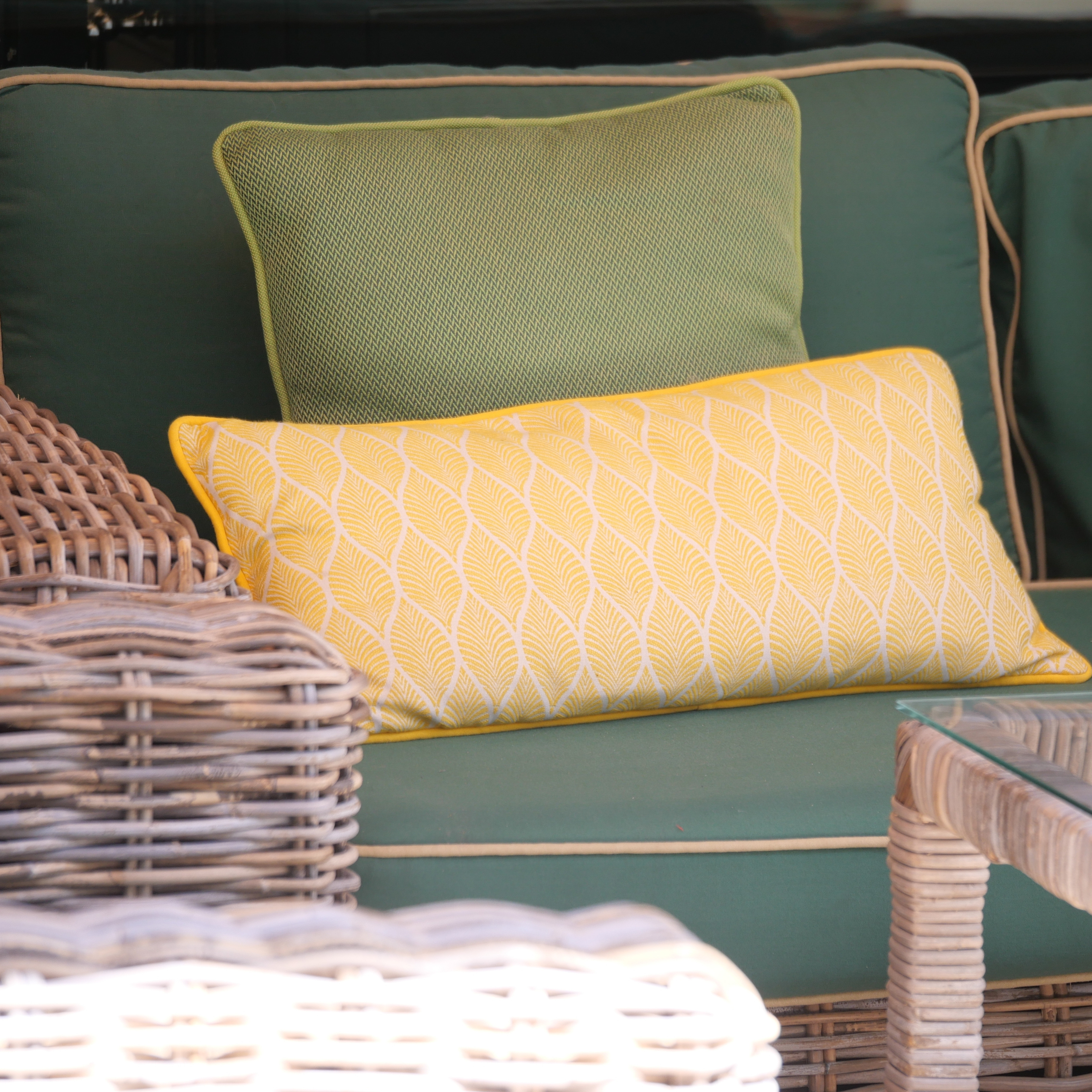Garden seating with colourful outdoor cushions to create a comfortable and inviting space