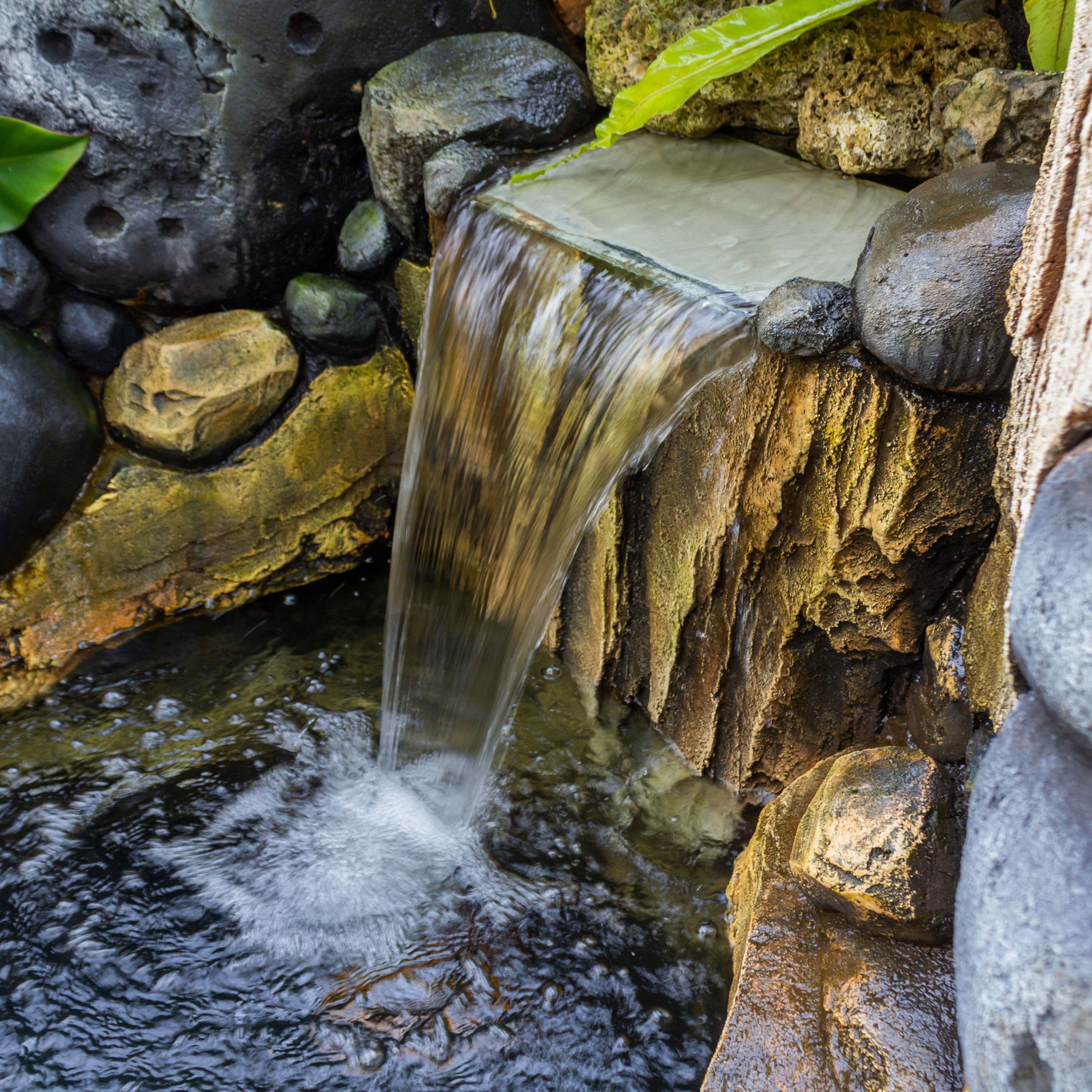 Garden pond waterfall improving water oxygenation