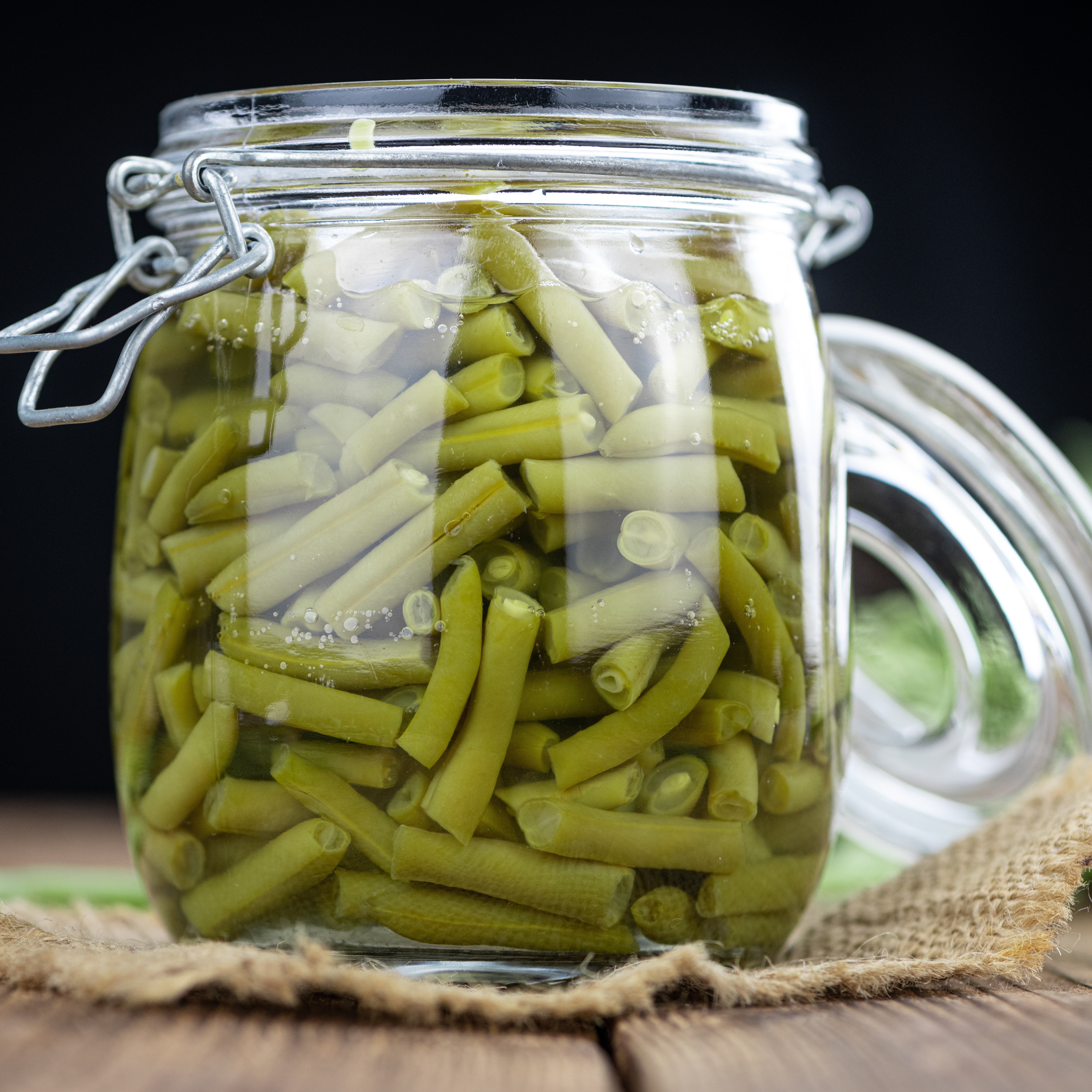 Jar containing preserved green beans.