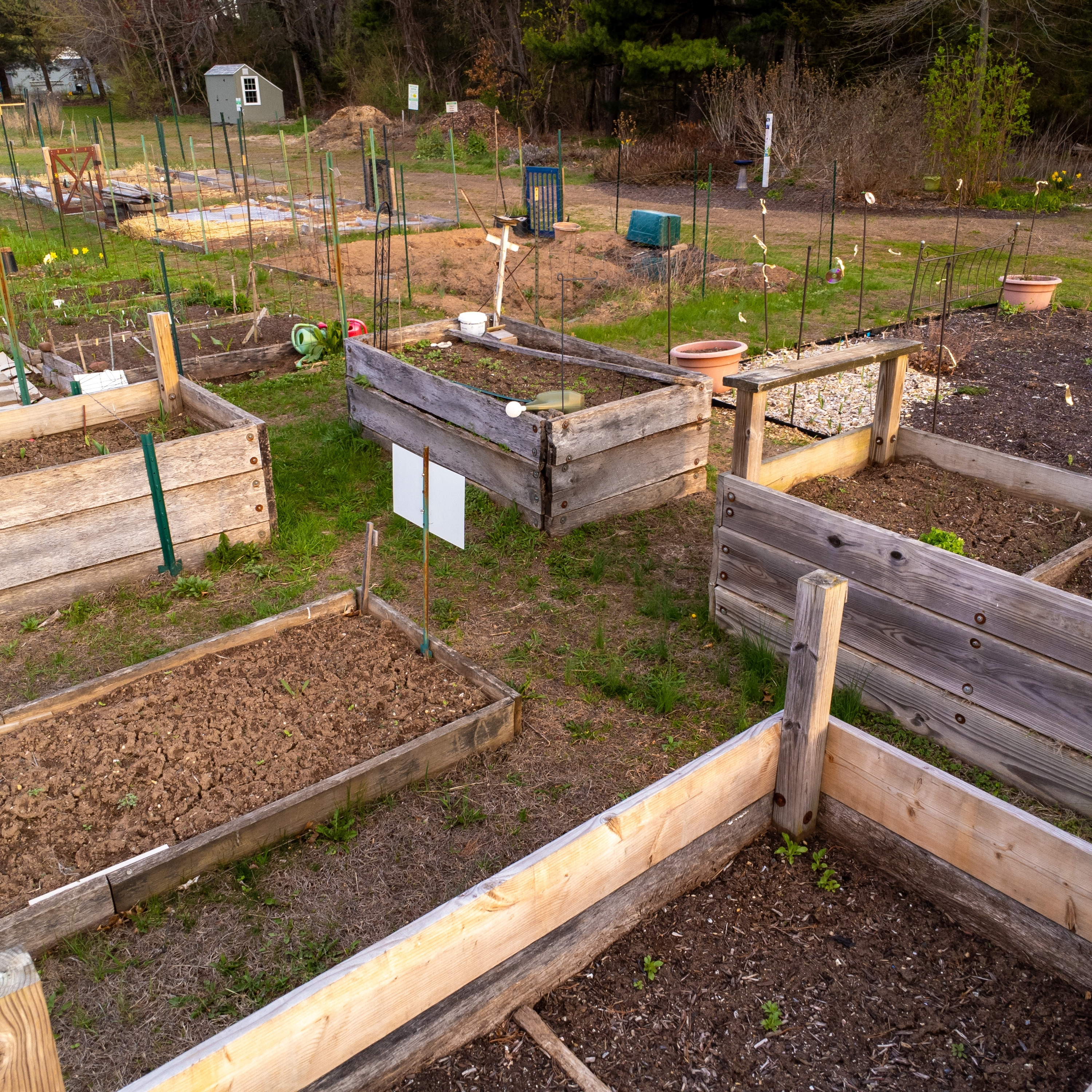 Raised garden beds built at different heights to suit a variety of crops and gardening needs.